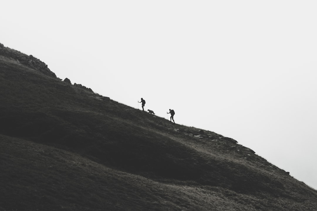 Hiker climbing a steep incline