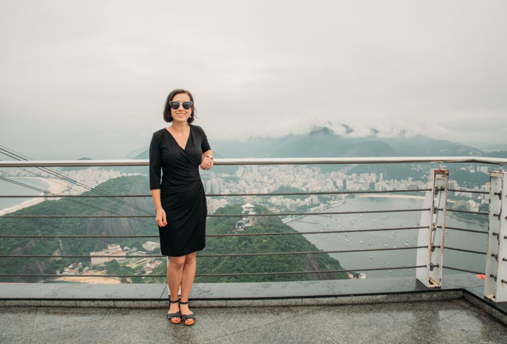 A woman traveling in Brazil wearing a black dress