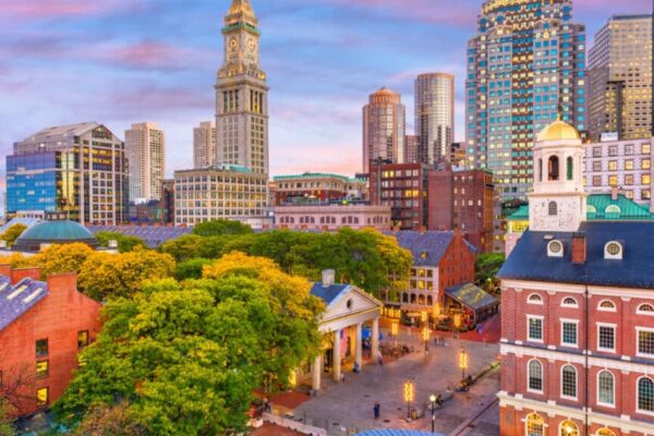 Boston, Massachusetts, USA skyline with Faneuil Hall and Quincy Market at dusk.