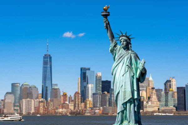 The Statue of Liberty over the Scene of New york cityscape river side which location is lower manhattan,Architecture and building with tourist concept