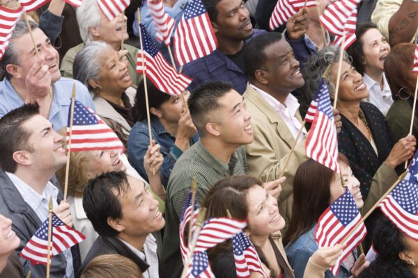 High angle view of happy multi ethnic people holding American flag