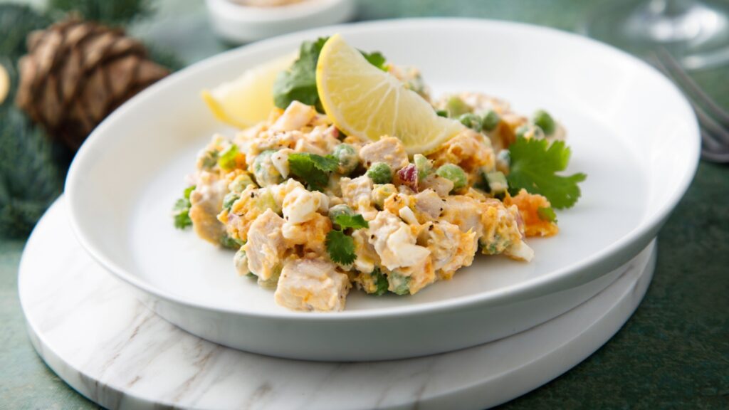 Traditional Russian Olivier salad with chicken