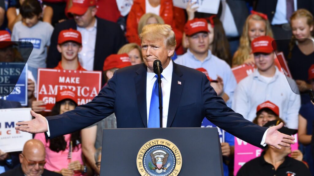 WILKES-BARRE, PA - AUGUST 2, 2018: President Donald Trump gestures "can you believe this" with wide open hands at a campaign rally for Congressman Lou Barletta.