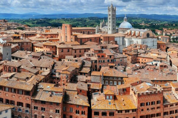 Medieval town Siena rooftop view with historic buildings in Italy