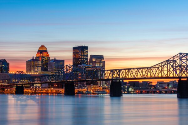 Louisville, Kentucky, USA skyline on the river at dusk.