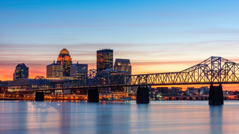 Louisville, Kentucky, USA skyline on the river at dusk.