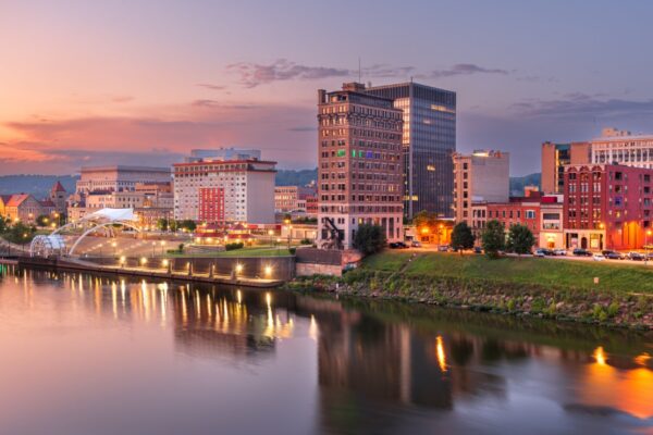 Charleston, West Virginia, USA skyline on the Kanawha River at dusk.