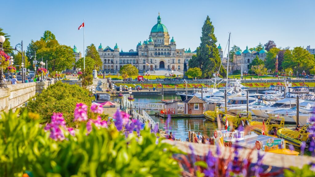 Victoria, British Columbia, Canada. Victoria Harbour and Parliament Buildings at sunny summer day. Inner Harbour, Popular tourist destination with eco-tours, unique shops, street food-July 19,2022