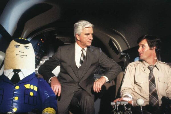 Leslie Nielsen, Robert Hays, and Otto in Airplane! (1980)