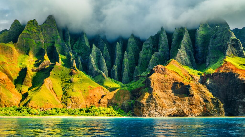 Na Pali coast, Kauai, Hawaii view from sea sunset cruise tour. Nature coastline landscape in Kauai island, Hawaii, USA. Hawaii travel.