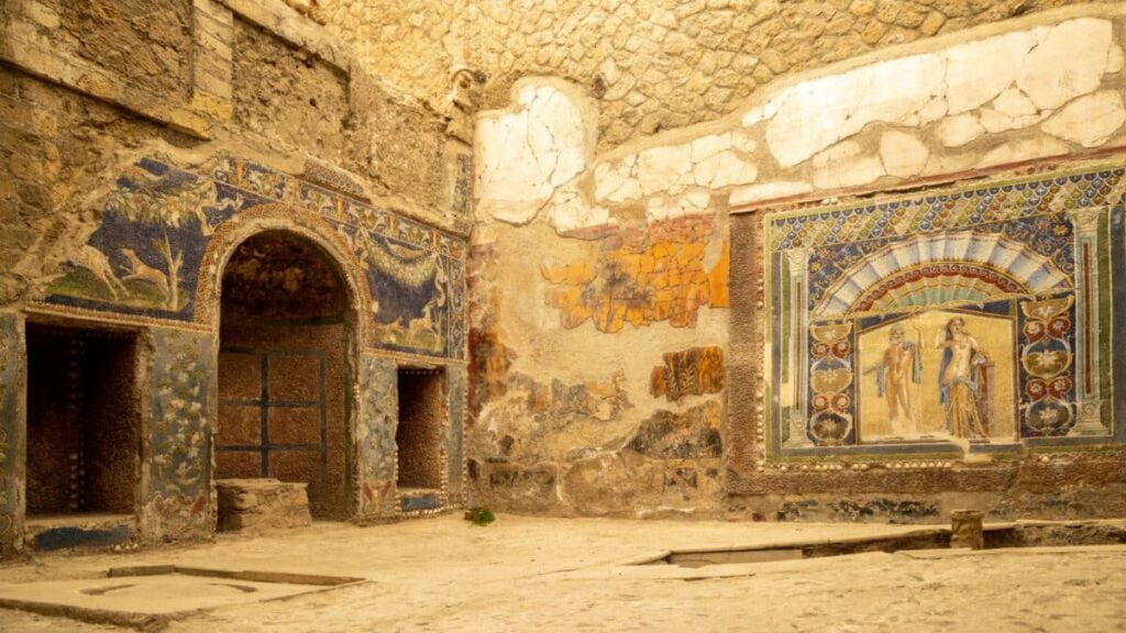 A Roman mosaic on a wall in the House of Neptune and Amphitrite. Ruins of ancient roman town Ercolano - Herculaneum, destroyed by the eruption of the Mount Vesuvius, Vesuvio volcano. Italy