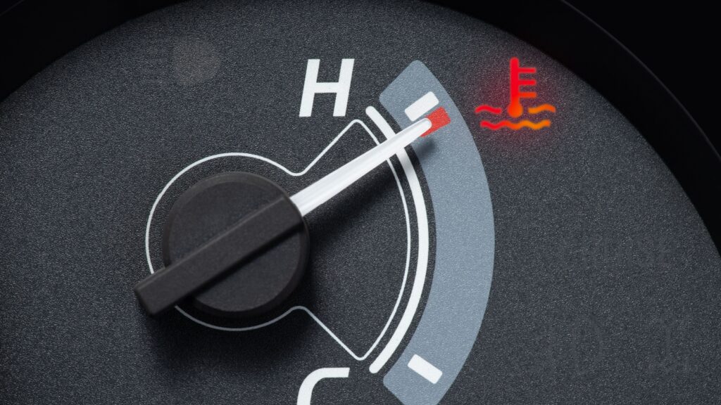 Needle pointer at the high temp point of the temperature gauge in the vehicle radiator and the symbol has the red light is on