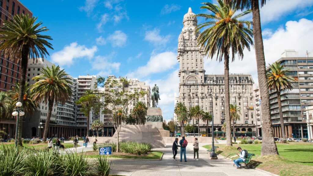 City of Montevideo, capital, Uruguay. April 13, 2023. Urban landscape of the famous Independencia square, in the background view of the historic Palacio Salvo building in the city center.