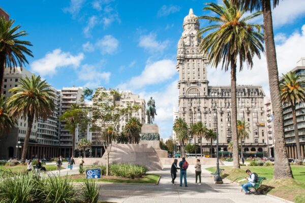 City of Montevideo, capital, Uruguay. April 13, 2023. Urban landscape of the famous Independencia square, in the background view of the historic Palacio Salvo building in the city center.