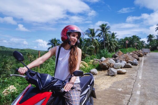 Woman riding scooter in Vietnam