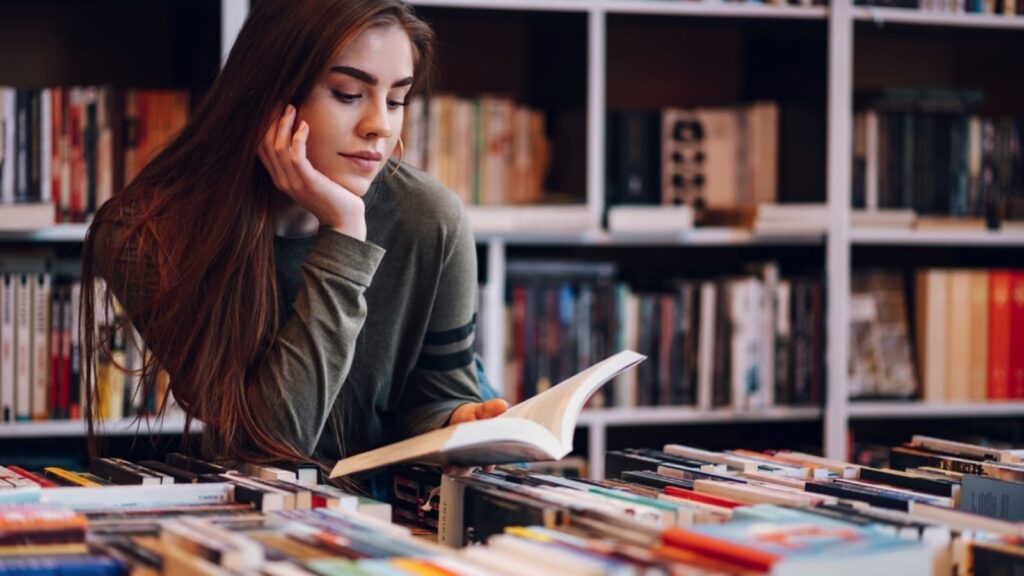 woman-in-library-reading-book