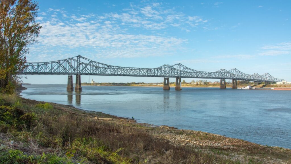 The Natchez–Vidalia Bridge over the Mississippi River seen from the Under The Hill district in Natchez, Adams County, Mississippi, USA