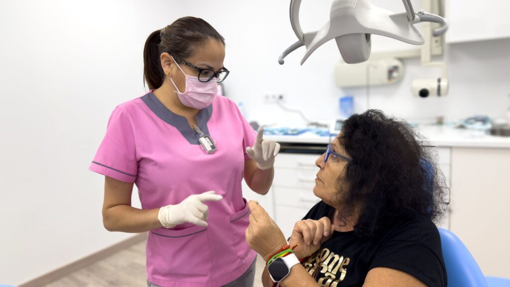 Doctor of Dentistry performing dental surgery on a patient.