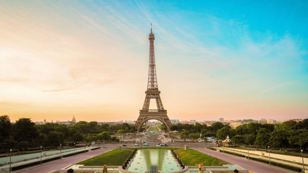 Paris Eiffel Tower and Trocadero garden at sunset in Paris, France. Eiffel Tower is one of the most famous landmarks of Paris.