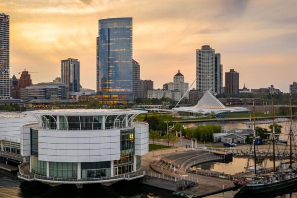 Milwaukee, WI / USA - June 04, 2019: Aerial view of Milwaukee, Wisconsin featuring the Discovery World, the Dennis Sullivan sailing vessel , Lakeshore Park and the Milwaukee Art Museum