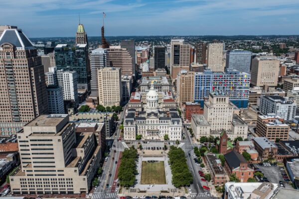 Baltimore, MD, USA - 7-1-24, aerial city view of area around city ​​hall for Baltimore city mayor located in Downtown Baltimore next to war memorial plaza, surrounded by skyscraper skyline