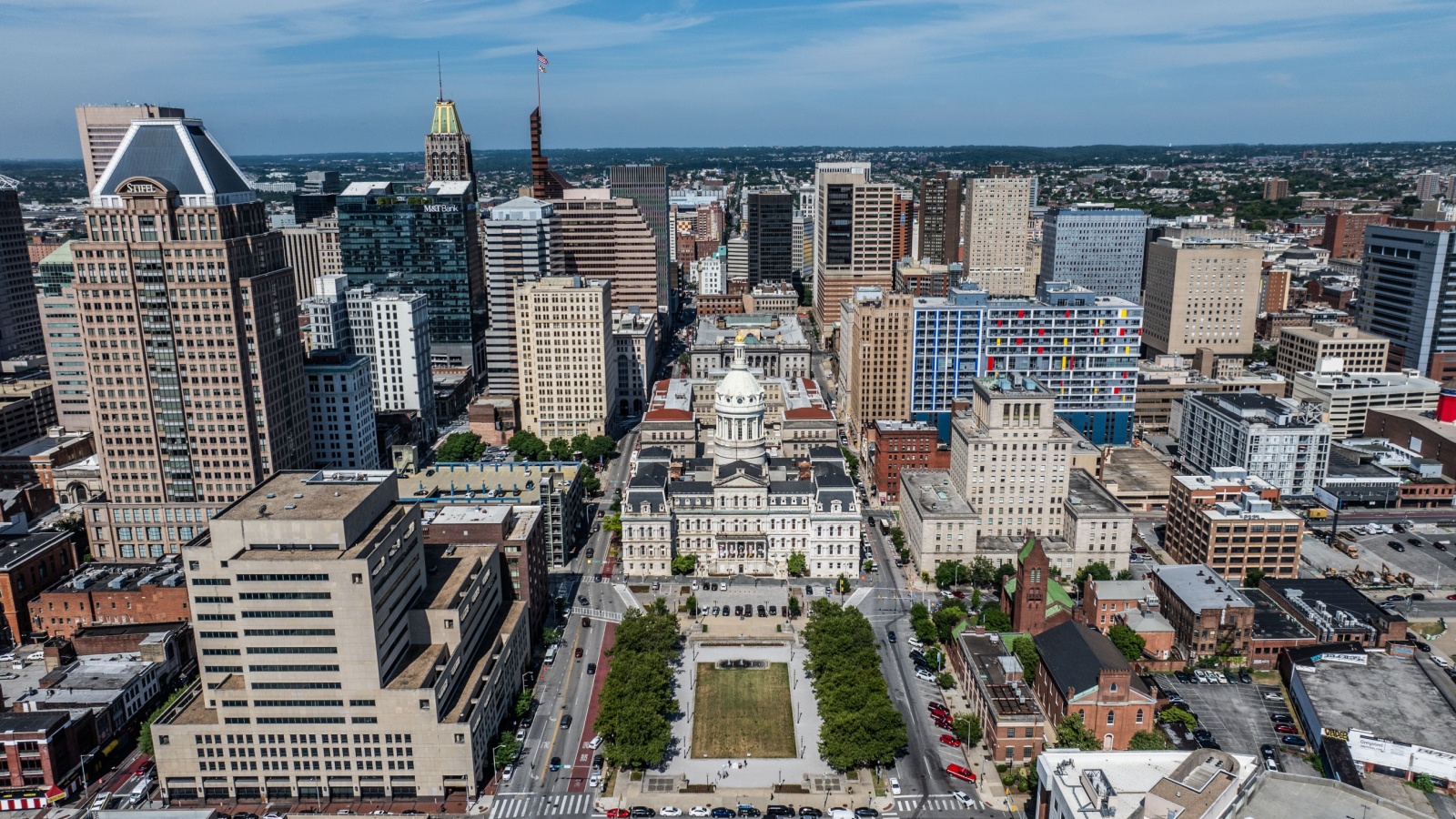 Baltimore, MD, USA - 7-1-24, aerial city view of area around city ​​hall for Baltimore city mayor located in Downtown Baltimore next to war memorial plaza, surrounded by skyscraper skyline