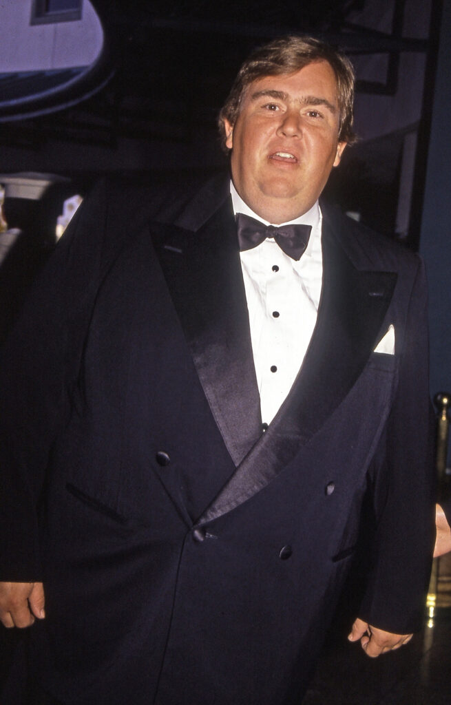 Los Angeles, California - exact date unknown - circa 1991: late actor and comedian John Candy arriving at a formal celebrity event