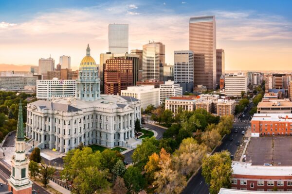 Aerial view of Colorado Capitol and Denver, Colorado skyline at sunset. Denver is a consolidated city and county, the capital, and most populous city of the U.S. state of Colorado